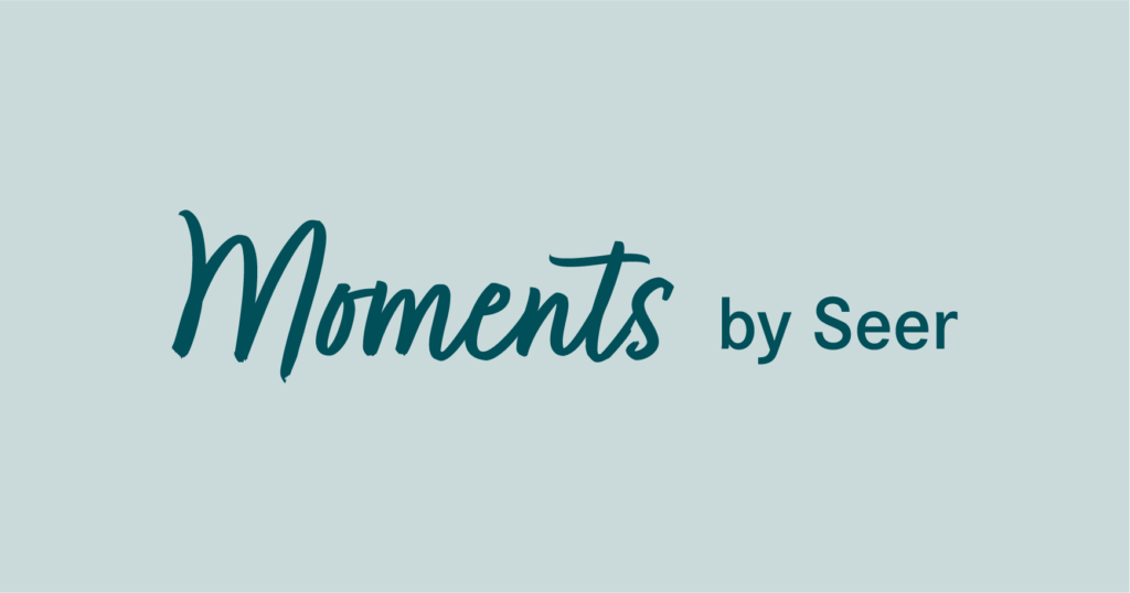 'Moments by Seer' logo.